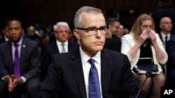 Acting FBI Director Andrew McCabe sits with a folder marked "Secret" in front of him while testifying on Capitol Hill in Washington, May 11, 2017.