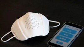 Japanese startup Donut Robotics' c-mask and its mobile phone application is pictured during a demonstration in Tokyo, Japan June 23, 2020. Picture taken June 23, 2020. (REUTERS/Kim Kyung-Hoon)