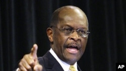 Republican presidential candidate, Herman Cain makes a point during a speech at a campaign rally, in Dayton, Ohio, November 30, 2011.