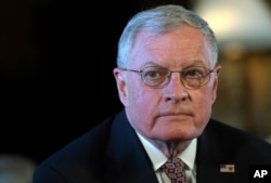 Retired Army Lt. Gen. Keith Kellogg listens as Trump announces that Army Lt. Gen. H.R. McMaster will be the new national security adviser. Kellogg, who had been his acting adviser, will now serve as chief of staff of the National Security Council.