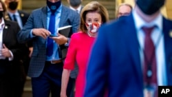 House Speaker Nancy Pelosi of California arrives for a House Democratic caucus meeting on Capitol Hill in Washington, Sept. 28, 2021. 