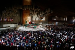 People attend a Mass remembering the victims of the recent 7.1-magnitude earthquake, at the Basilica of Guadalupe, in Mexico City, Sept. 24, 2017.