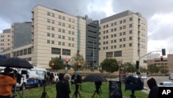 A large gathering of media personnel camp outside the Ronald Reagan UCLA Medical Center in Los Angeles, Dec. 23, 2016, where TMZ and the Los Angeles Times reported actress Carrie Fisher had been taken after suffering a medical emergency on a flight from London to Los Angeles. 