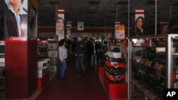 Customers are seen standing in an electronics store after a power failure, in Simferopol, Crimea, Nov. 22, 2015.