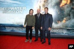 Director Peter Berg, from right, oil rig manager Mike Williams and actor Mark Wahlberg arrive at the premiere of the film 'Deepwater Horizon' in London, Monday, Sept. 26, 2016.