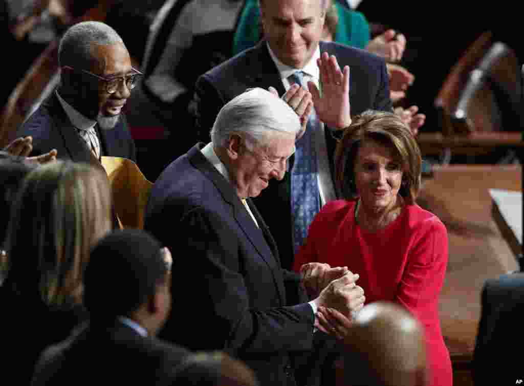House Democratic Leader Nancy Pelosi of California, who is expected to lead the 116th Congress as speaker of the House, and House Minority Whip Steny Hoyer, D-Md., are applauded at the Capitol in Washington, Jan. 3, 2019.