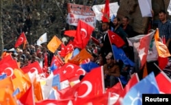Supporters of the ruling AK Party wave Turkish and party flags during an election rally in Konya, central Turkey, Mar. 28, 2014.