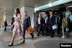 Turkish Deputy Foreign Minister Sedat Onal (2nd-L) leaves after a meeting with U.S. Deputy Secretary of State John Sullivan at State Department in Washington, U.S., Aug. 8, 2018, without reaching an agreement.