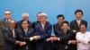 U.S. Secretary of State John Kerry, foreground third left, poses for a group picture with foreign ministers before commencing the 4th East Asia Summit (EAS) Foreign Ministers' Meeting in Naypyitaw, Myanmar, Sunday, Aug. 10, 2014.