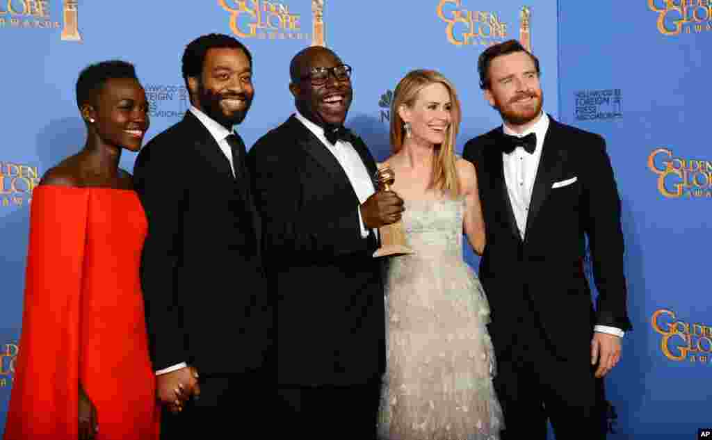 Lupita Nyong'o, Chiwetel Ejiofor, Steve McQueen, Sarah Paulson, and Michael Fassbender pose with the award for best motion picture - drama for '12 Years a Slave' at the Golden Globe Awards, Jan. 12, 2013.