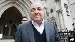 FILE - Self-exiled oligarch Boris Berezovsky leaves the High Court in London, March 10, 2010.