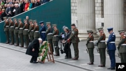 Irish President Michael D Higgins lays a wreath at the General Post Office on O'Connell street, Dublin, Ireland, March 27, 2016.