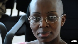 A file picture taken on November 10, 2011 shows Rwandan opposition leader Victoire Ingabire posing at the Rwandan High Court in Kigali. 