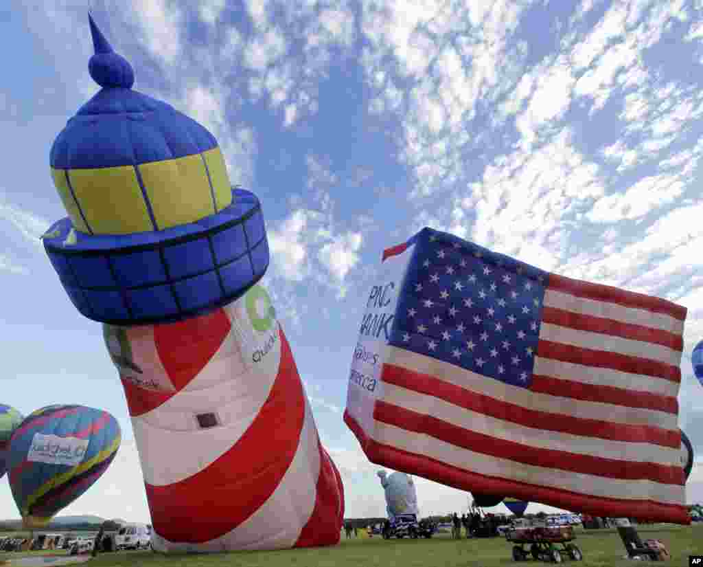 Hot air balloons are inflated&nbsp;during the 31st annual QuickChek New Jersey Festival of Ballooning, in Readington Township. Superstorm Sandy will be on the minds of participants at the&nbsp;event this weekend, which runs from Friday to Sunday and features 100&nbsp;balloons.