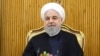 In this photo released by the official website of the office of the Iranian Presidency, President Hassan Rouhani sits at the Mehrabad airport pavilion before leaving Tehran, Iran, for New York to attend United Nations General Assembly, Monday, Sept…