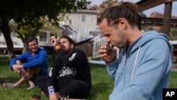 Michael Vasconez, a facilitator with Hummingbird Church, blows a sacred tobacco snuff used by shaman in Brazil and Peru into his nose, while leading an integration circle, Oct. 16, 2022, in Hildale, Utah.