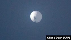 This photo from Chase Doak taken on Feb. 1, 2023, and released on Feb. 2 2023, shows a suspected Chinese spy balloon in the sky over Billings, Montana.