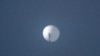 FILE - This photo from Chase Doak taken on Feb. 1, 2023, and released on Feb. 2 2023, shows a suspected Chinese spy balloon in the sky over Billings, Montana.