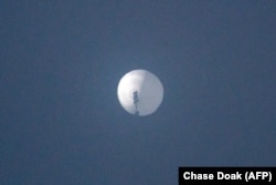 This photo from Chase Doak taken on Feb. 1, 2023, and released on Feb. 2 2023, shows a suspected Chinese spy balloon in the sky over Billings, Montana.