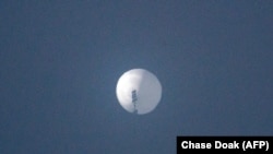 This photo from Chase Doak taken on Feb. 1, 2023, and released on Feb. 2 2023, shows a suspected Chinese spy balloon in the sky over Billings, Montana.