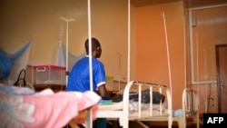 FILE - A patient with acquired immunodeficiency syndrome sits at the community hospital in Bangui, Central African Republic, on Jan. 27, 2022. Twelve African countries on Wednesday spelled out plans for ending AIDS in children by 2030.