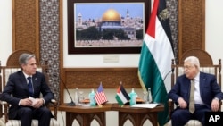 US Secretary of State Antony Blinken, left, meets with Palestinian leader Mahmoud Abbas in the West Bank town of Ramallah, Jan. 31, 2023. 