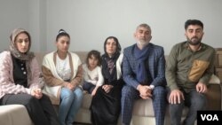The Büyüksu family is pictured at their home in Izmir, Turkey, Dec. 1 2022.