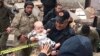 A baby is rescued from a destroyed building in Malatya, Turkey, Feb. 6, 2023. (DIA Images via AP)