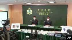 In this image made from a video, Hong Kong Customs officials speak at a press conference in Hong Kong, Jan. 27, 2023. Hong Kong banned cannibidiol, also known as CBD, as a 'dangerous drug' and imposed harsh penalties for possession on Wednesday. 