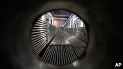 A cross-section of a prototype reactor is shown inside Last Energy's microreactor demonstration unit, Jan. 17, 2023, in Brookshire, Texas. (AP Photo/David J. Phillip)