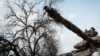 A Ukrainian service man rides on a main battle tank in Bakhmut on Feb. 5, 2023.