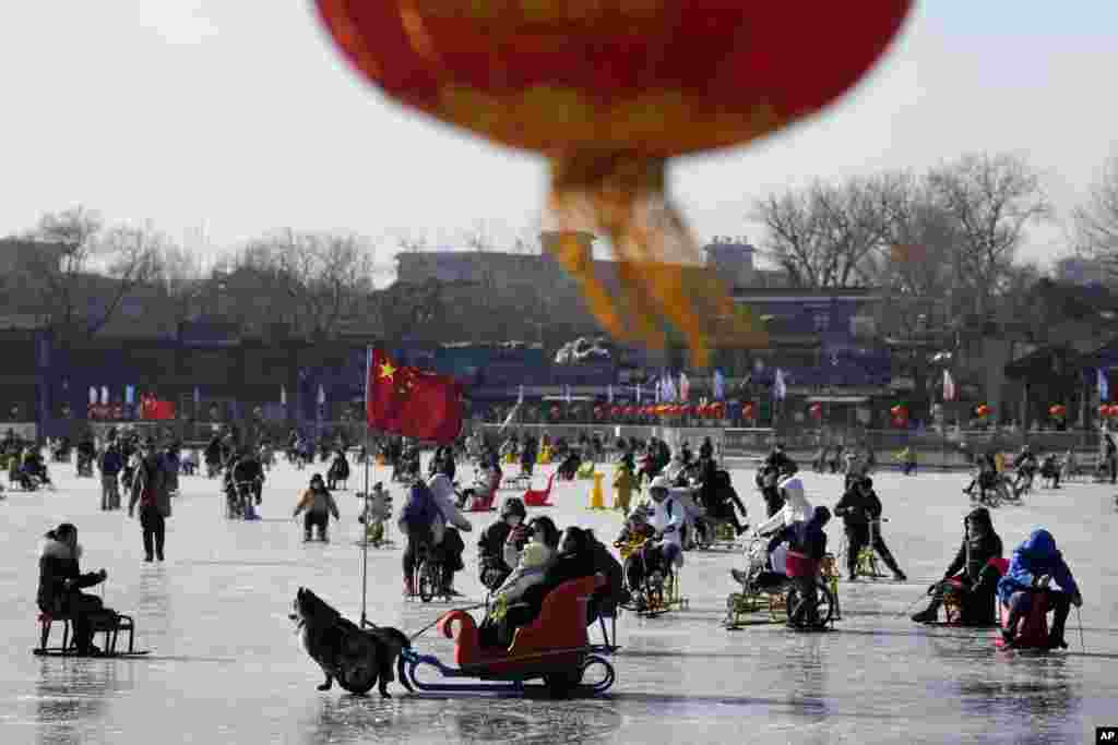 Residents enjoy skating on the frozen Houhai Lake in Beijing, China.