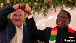Zimbabwean President Emmerson Mnangagwa and Belarus President Alexander Lukashenko after signing a Memorandum of Understanding (MOU) at the State House in Harare, Zimbabwe, January 31, 2023. REUTERS/Philimon Bulawayo