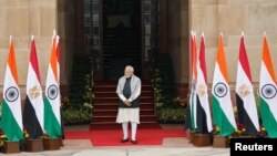 Indian Prime Minister Narendra Modi waits for Egyptian President Abdel Fattah El Sisi to arrive before their meeting at the Hyderabad House in New Delhi, Jan. 25, 2023. 