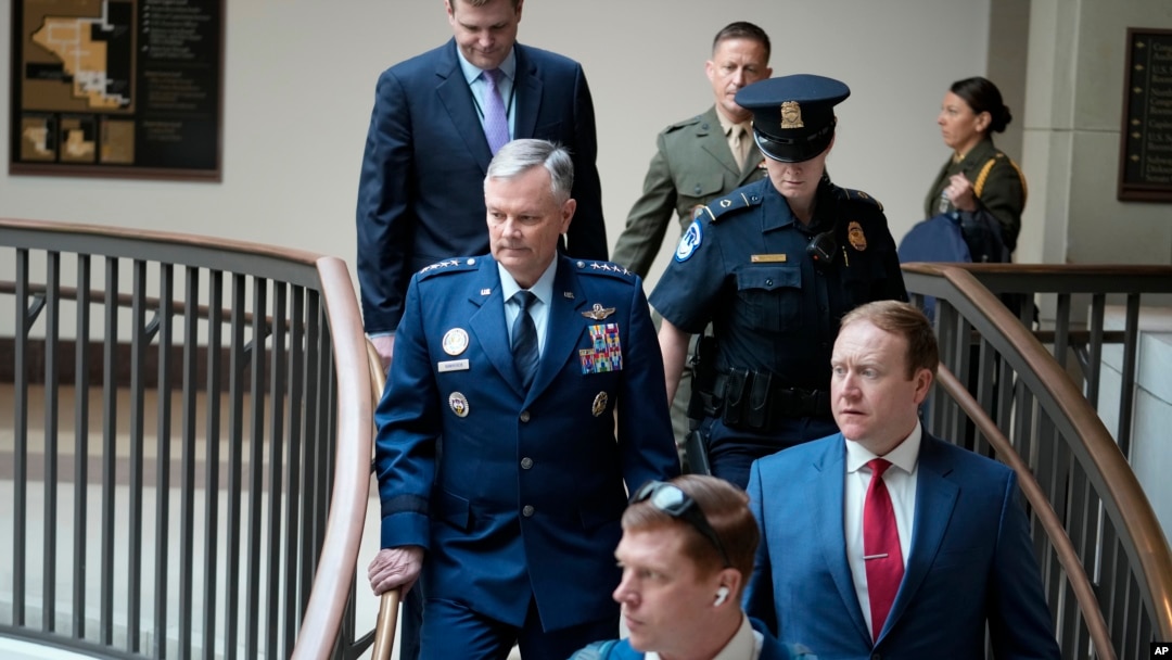 Lawmakers and intelligence advisers, including Gen. Glen VanHerck, left, commander of the U.S. Northern Command and North American Aerospace Defense Command, arrive for a closed briefing on the Chinese surveillance balloon that flew over the U.S., in Washington, Feb. 9, 2023.