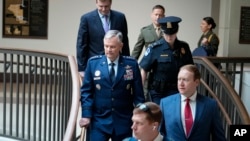 Lawmakers and intelligence advisers, including Gen. Glen VanHerck, left, commander of the U.S. Northern Command and North American Aerospace Defense Command, arrive for a closed briefing on the Chinese surveillance balloon that flew over the U.S., in Washington, Feb. 9, 2023.
