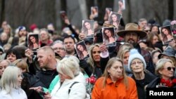 Mourners attend a public memorial for singer Lisa Marie Presley, the only daughter of the "King of Rock 'n' Roll," Elvis Presley, at Graceland Mansion, in Memphis, Tennessee, Jan. 22, 2023.