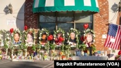 Portrait pictures of the victims are at a memorial outside the Star Ballroom Dance Studio entrance after a mass shooting during Chinese Lunar New Year celebrations in Monterey Park, California, U.S., January 23, 2023.