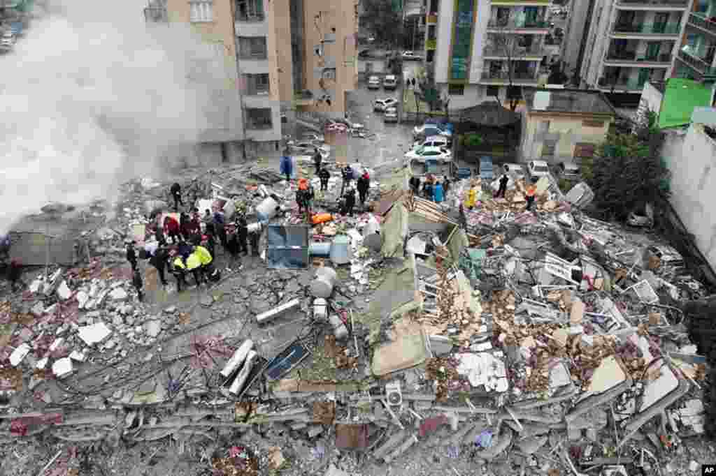 Emergency teams search for people in a destroyed building in Kahramanmaras, Turkey, Feb. 6, 2023. 