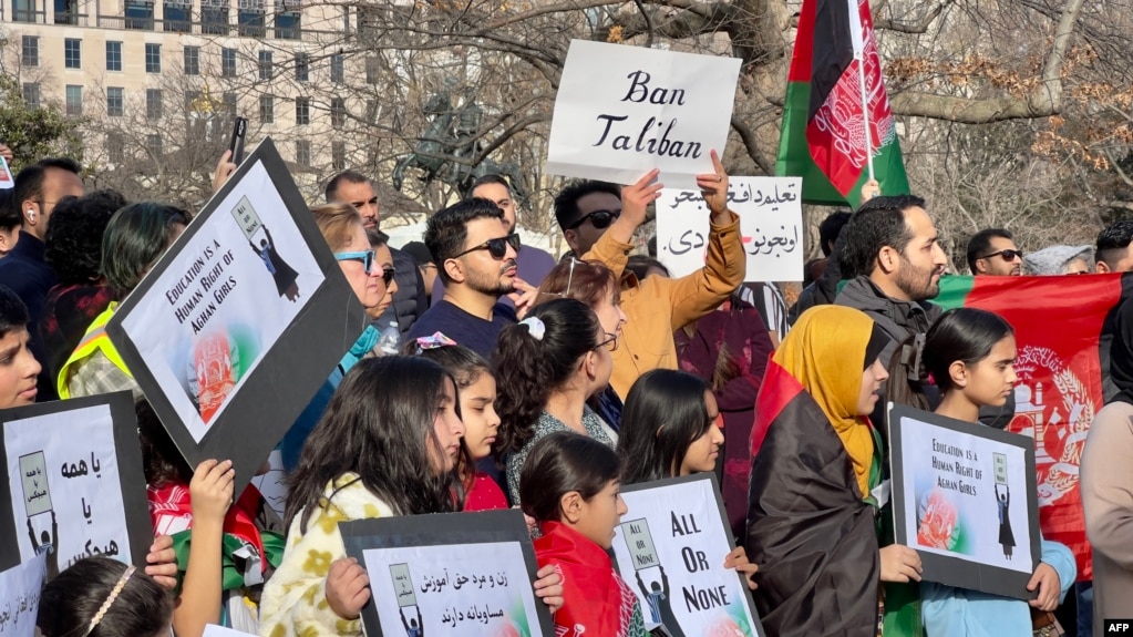 FILE - People demonstrate in front of the White House in Washington, January 1, 2023, against the Afghan Taliban regime's ban on higher education for women.