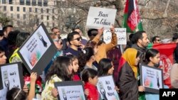 FILE - People demonstrate in front of the White House in Washington, January 1, 2023, against the Afghan Taliban regime's ban on higher education for women.