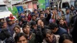 FILE - Residents protest as they wait outside a gas plant to buy propane for cooking in downtown Cusco, Peru, Feb. 3, 2023. 