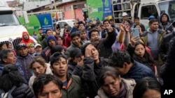 FILE - Residents protest as they wait outside a gas plant to buy propane for cooking in downtown Cusco, Peru, Feb. 3, 2023. 