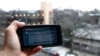 FILE - A ChatGPT prompt is shown on a device in Brooklyn, N.Y., Jan. 5, 2023. The popular online chatbot powered by artificial intelligence is also proving to be adept at creating disinformation and propaganda.