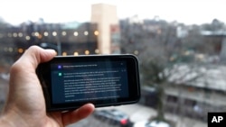 FILE - A ChatGPT prompt is shown on a device in Brooklyn, N.Y., Jan. 5, 2023. The popular online chatbot powered by artificial intelligence is also proving to be adept at creating disinformation and propaganda.