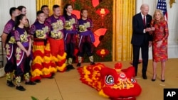 President Joe Biden and first lady Jill Biden speak during a reception to celebrate the Lunar New Year in the East Room of the White House in Washington, Jan. 26, 2023.