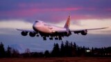 The final Boeing 747 lands at Paine Field following a test flight, Tuesday, Jan. 10, 2023, in Everett, Wash. (Jennifer Buchanan/The Seattle Times via AP)