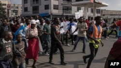 Demonstrators march during a demonstration against the East African Community Regional Force (EACRF) in Goma, eastern Democratic Republic of Congo, on January 18, 2023. 