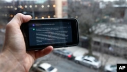 A ChatGPT prompt is shown on a device near a public school in Brooklyn, New York, Thursday, Jan. 5, 2023. (AP Photo/Peter Morgan)