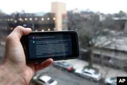 FILE - A ChatGPT prompt is shown on a device near a public school in Brooklyn, New York, Thursday, Jan. 5, 2023. (AP Photo/Peter Morgan)